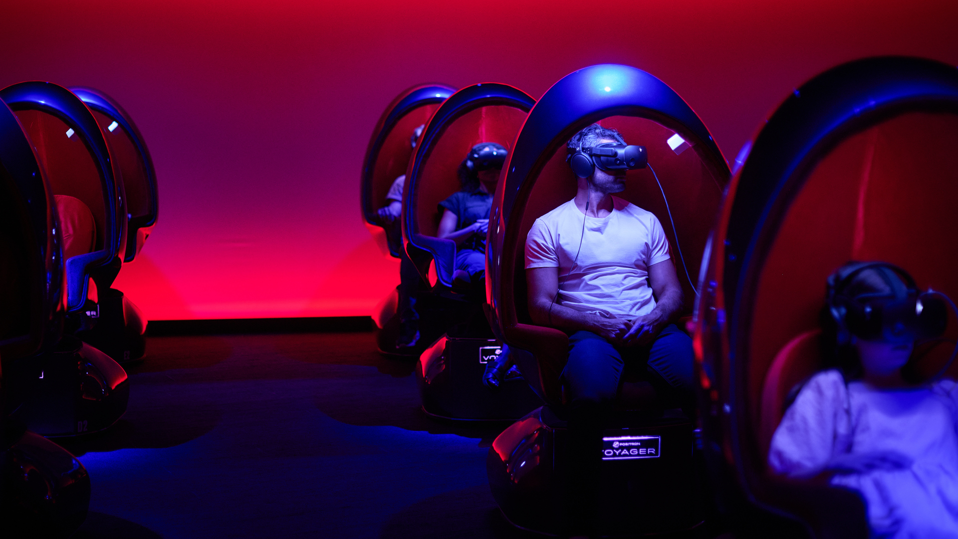 3 people on the Virtual Reality Positron chair - Voyager Theatre